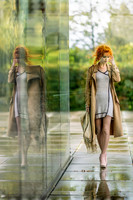 Yulia in Brühl: Yulia walks past a glass wall in Brühl, her reflection creating a ghostly double