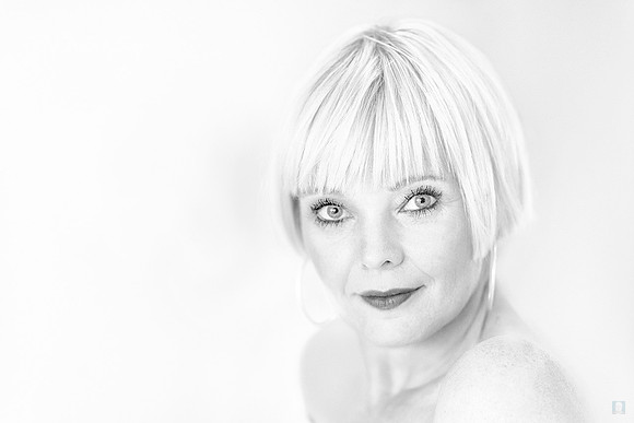 High-key black and white close-up portrait of Steffi featuring soft lighting and minimalist aesthetic