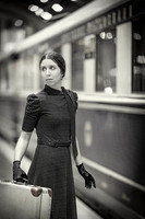 Pensive woman in retro attire gazes away, her silhouette reflecting a quiet, internal journey