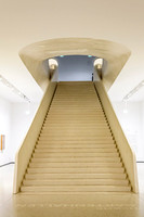 Staedel Museum Minimalist perspective of a grand, wide wooden staircase inside the Staedel Museum in Frankfurt